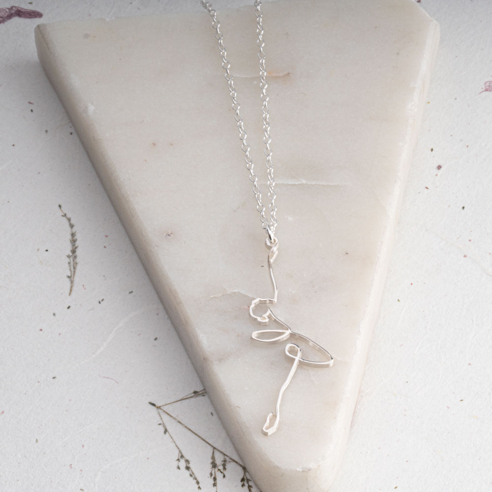Line Art Ballerina Necklace on a model