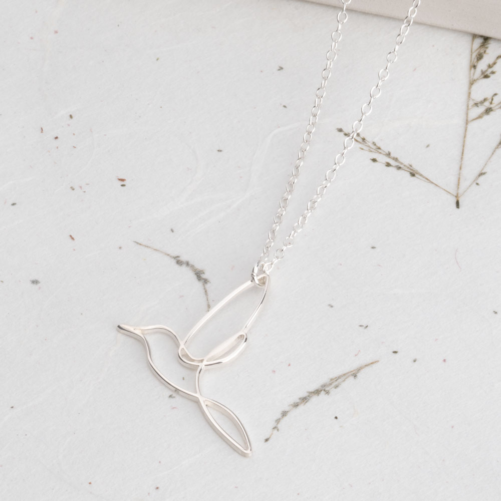 Line Art Hummingbird Necklace on a model