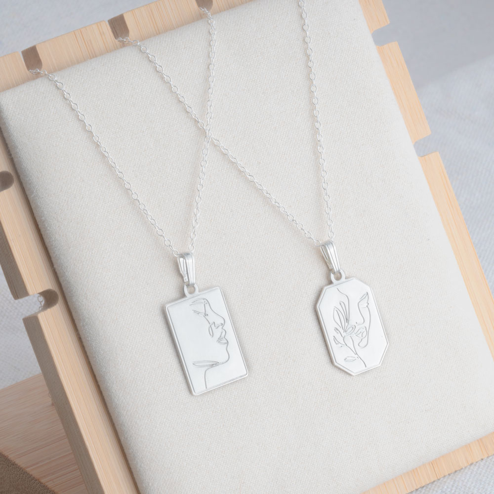 Engraved Necklace With Line Art Face on a model