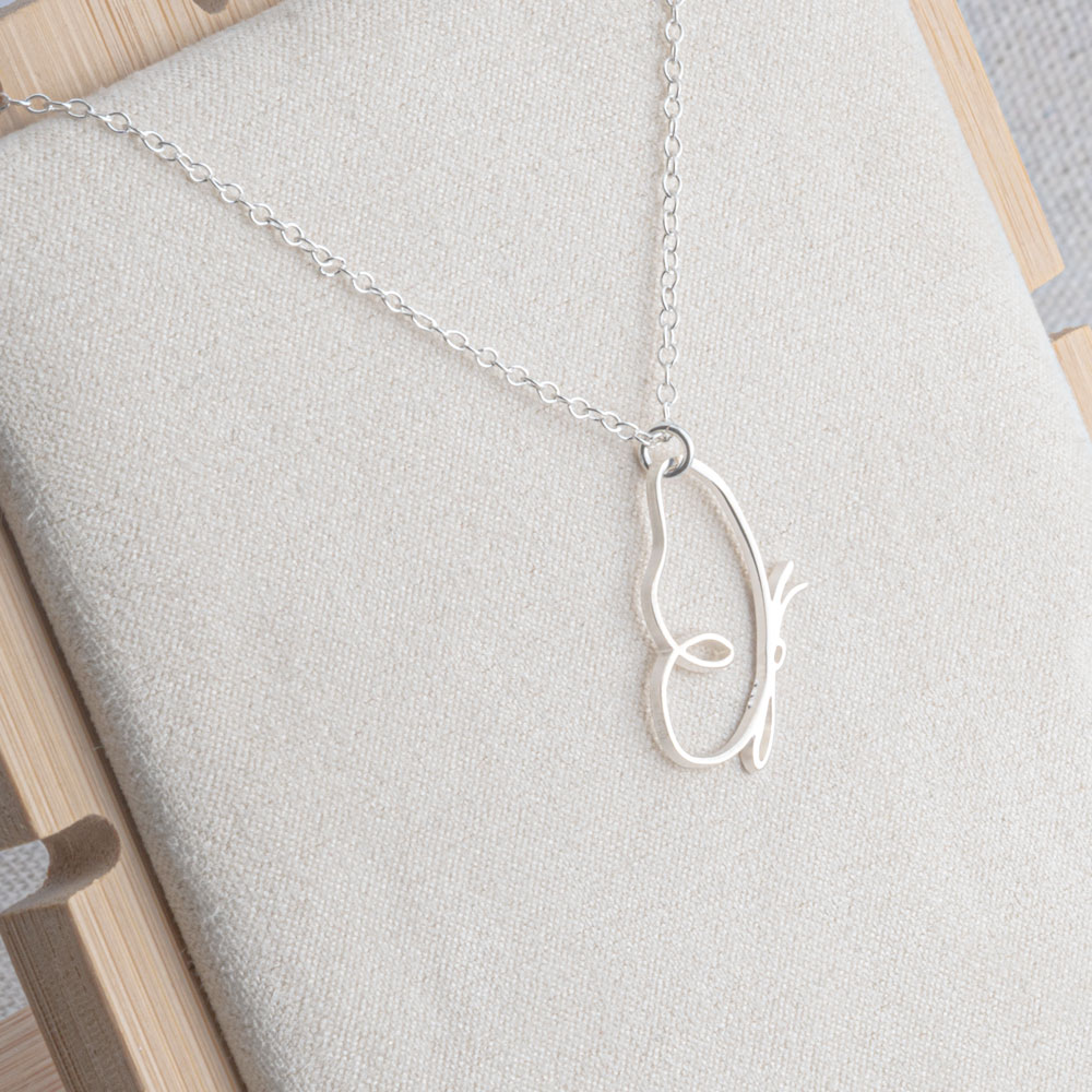 Line Art Butterfly Necklace on a model