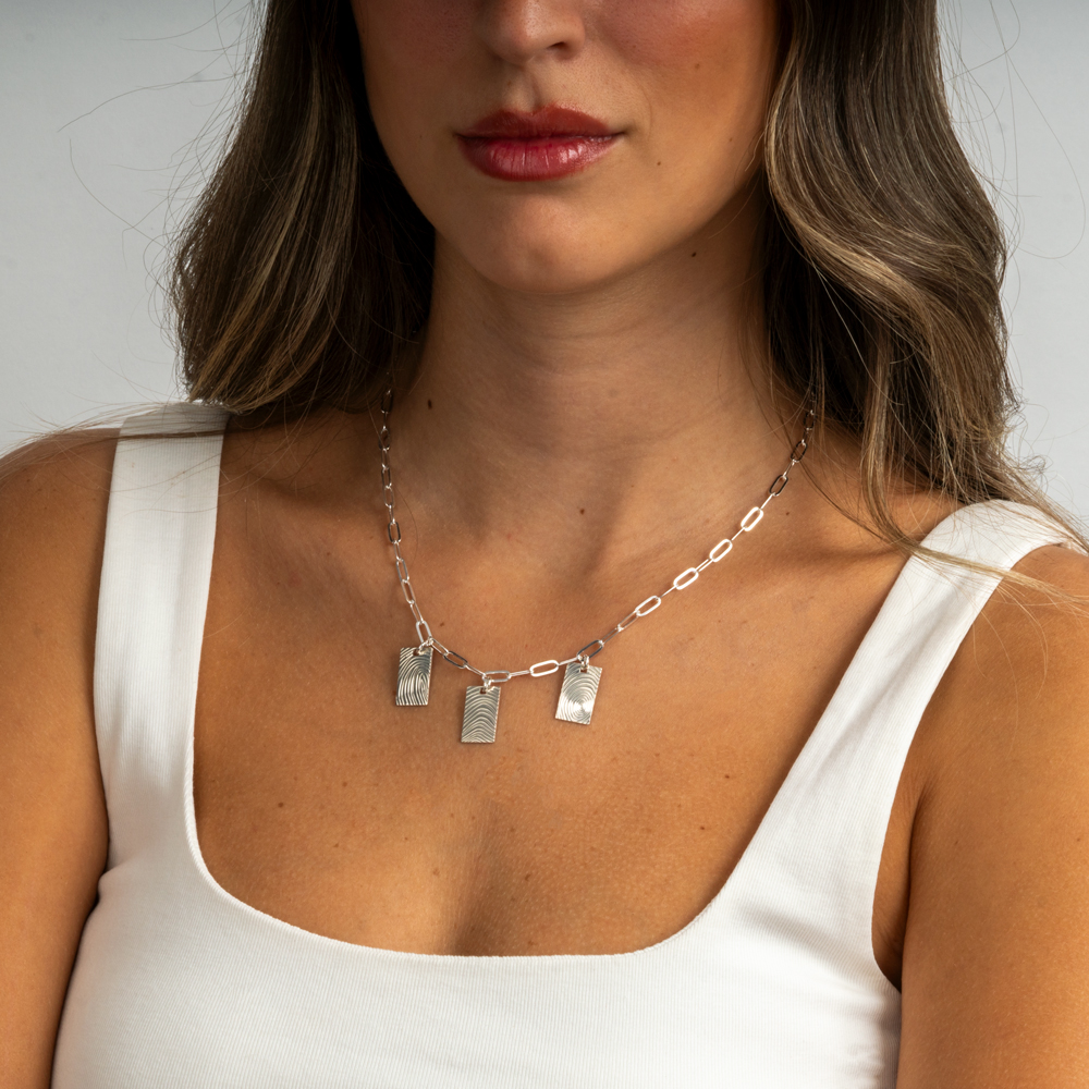 Multiple Fingerprint Charm Necklace on a model