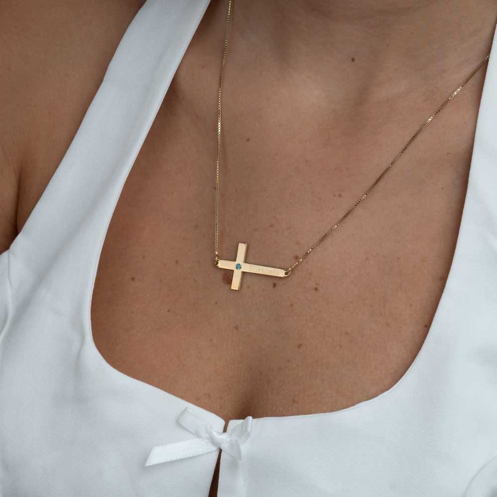cross with birthstone and name on a model