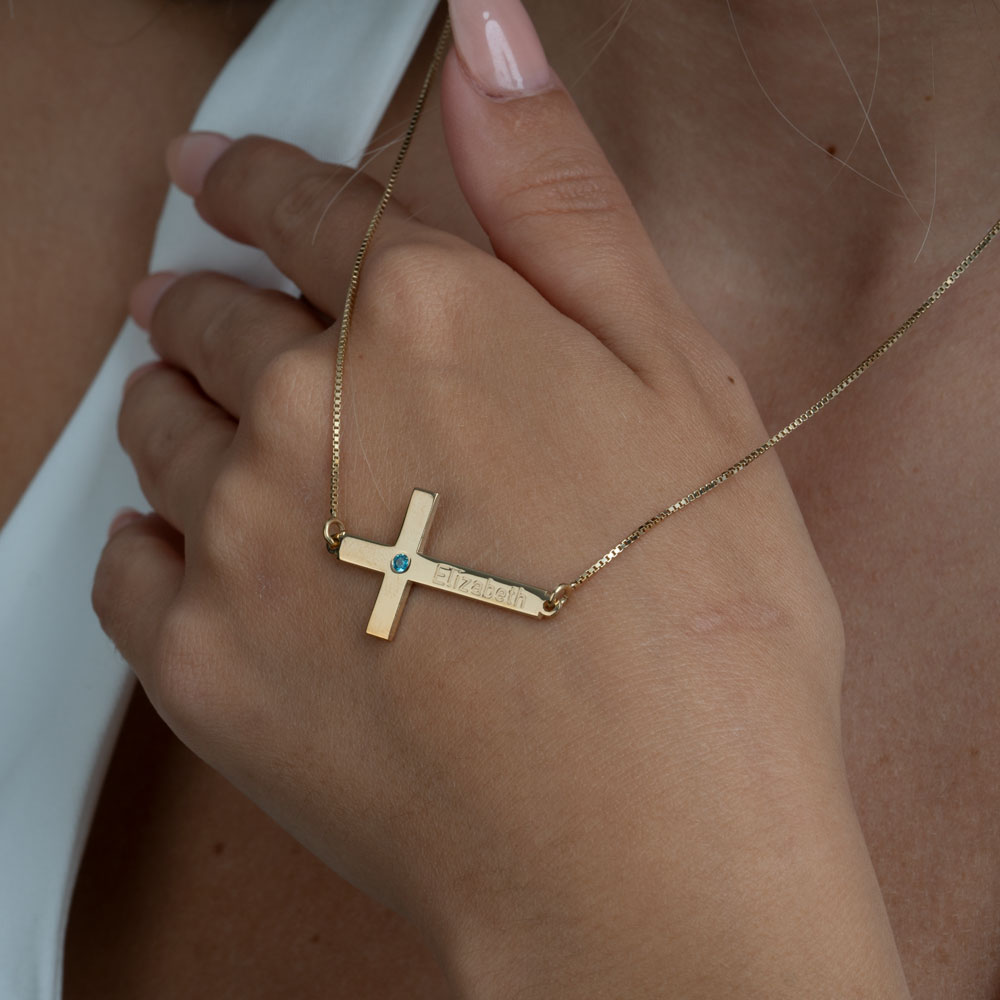 cross with birthstone and name on a model - 2