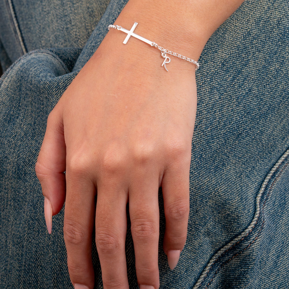 Custom Initial Cross Bracelet on a model