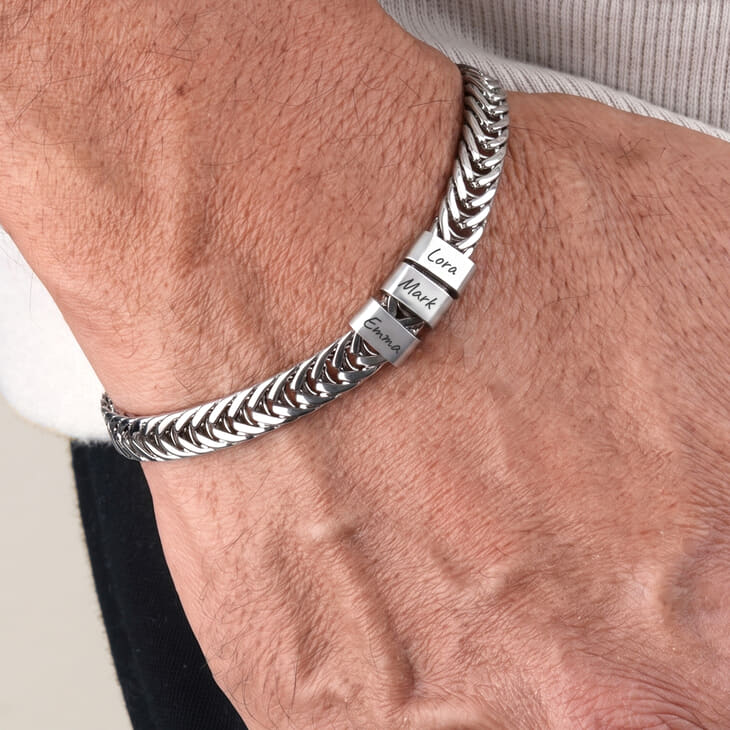 Silver personalized bracelet for Dad with Cora and Mark engraved.