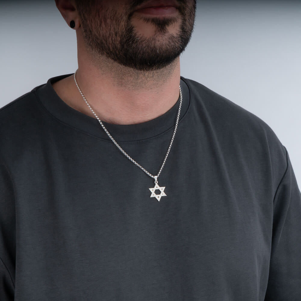 Casual look of a model featuring the Mini Judaica Star of David Necklace with sparkling zircons.