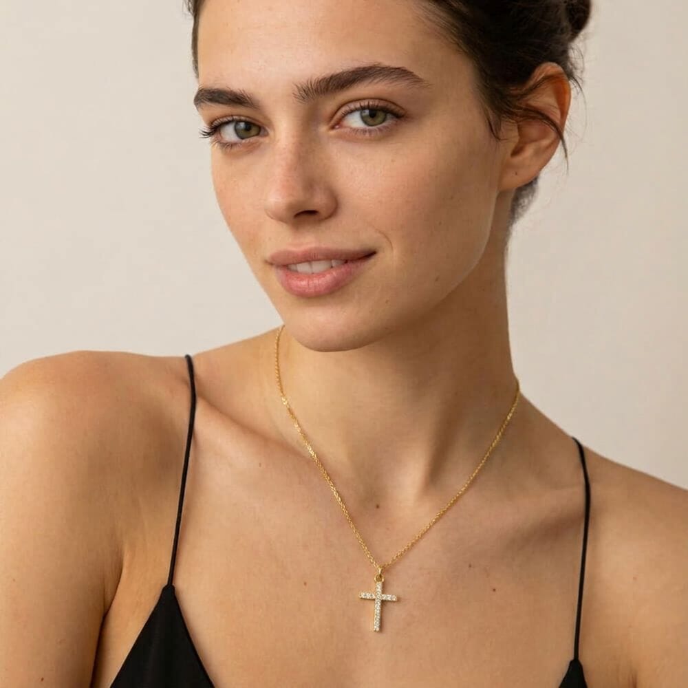 Model adorned with the Petite Zircon Cross Necklace highlighting a delicate cross design