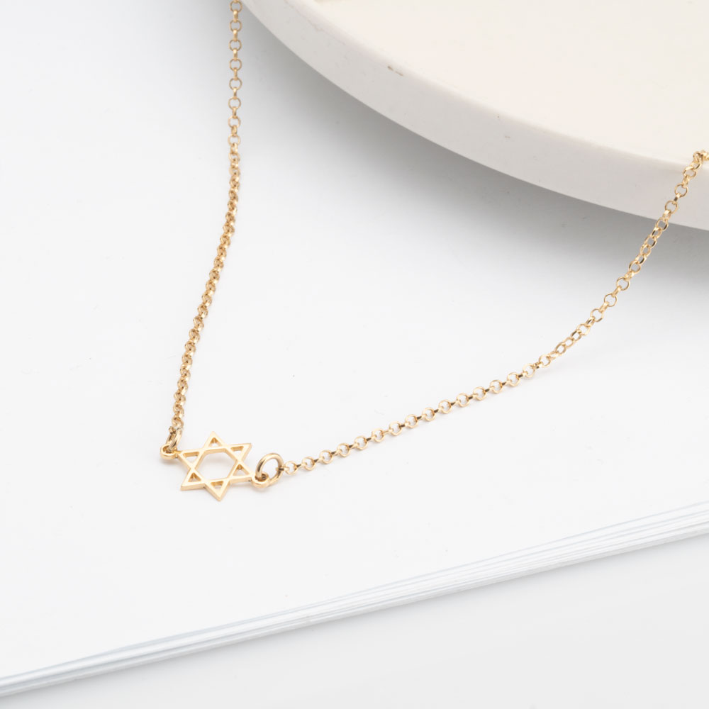 Sideways Star of David Necklace on a model