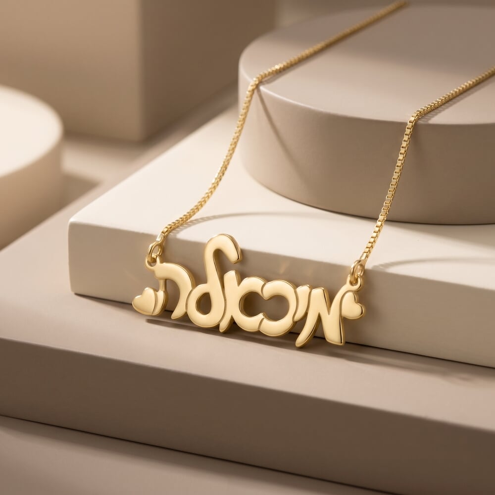 Fashion model featuring a Hebrew cursive name necklace with hearts, complementing her chic look