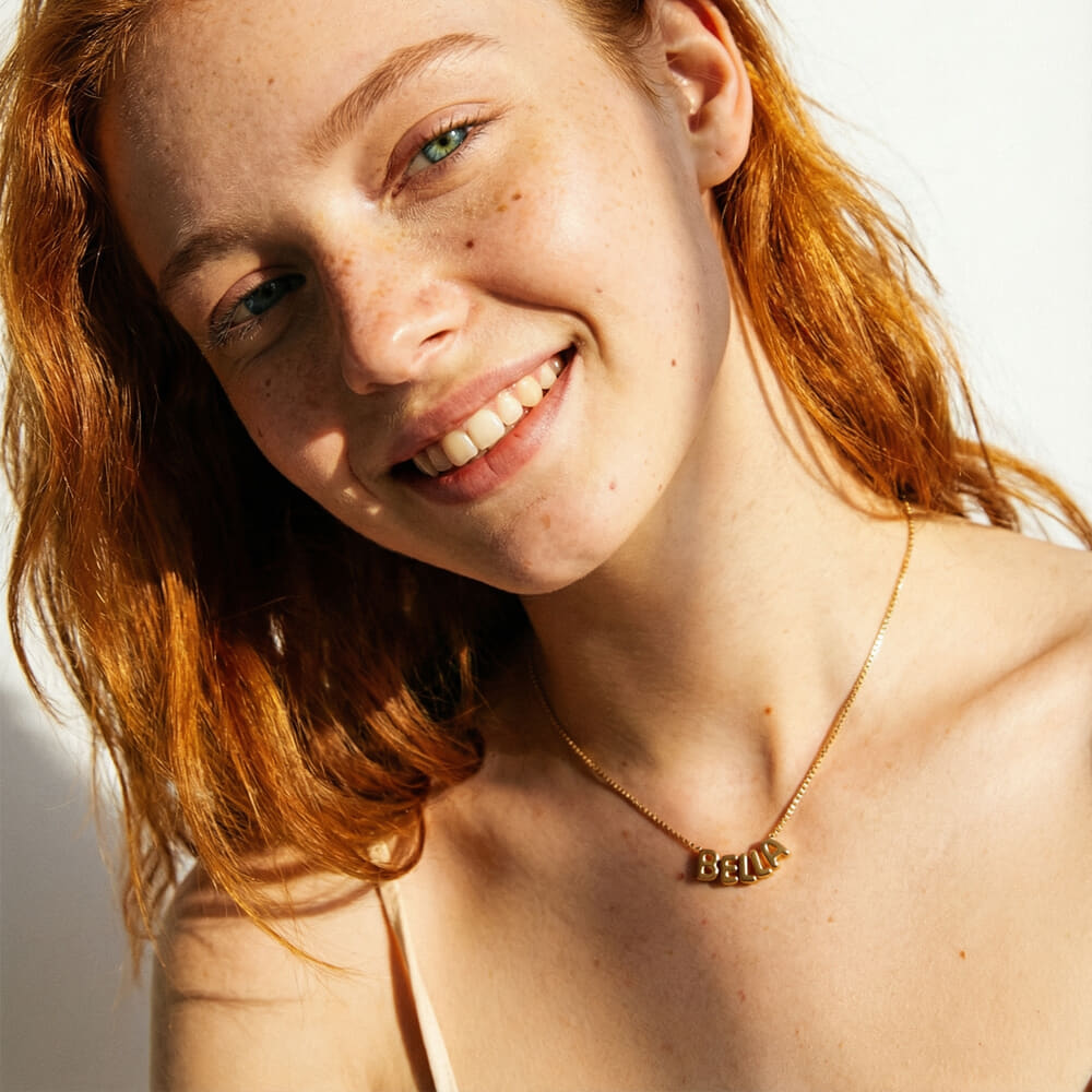 Custom Bubble Name Necklace on a model - 2