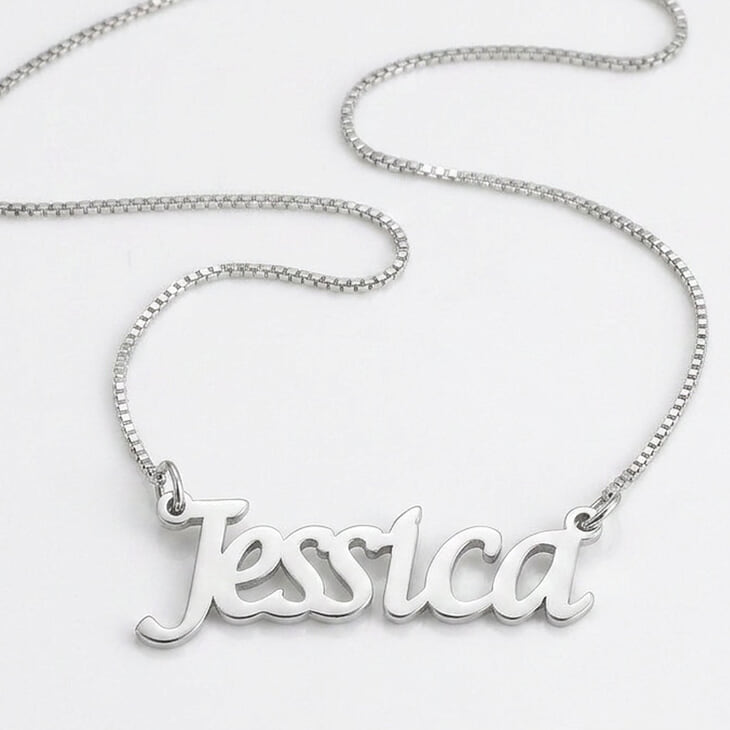 Stylish silver necklace with a personalized nameplate in cursive.