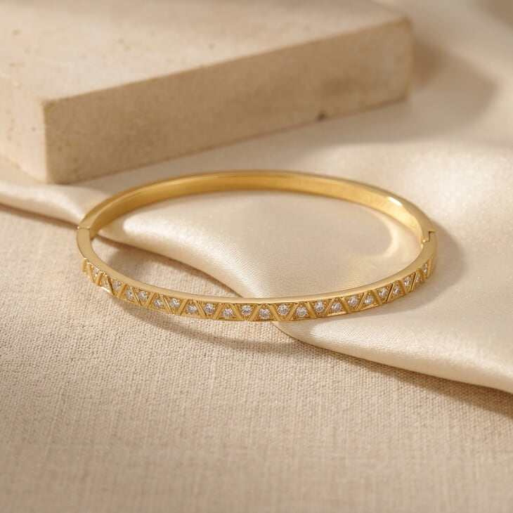 Full Zircon Bangle Bracelet beautifully placed on satin, revealing its stunning geometric design