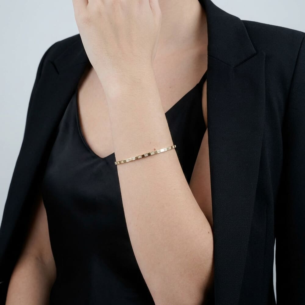 Gold Geometric Cubic Zirconia Bangle Bracelet on a model