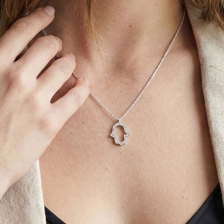 Hamsa Pendant with Zircons on a model 3