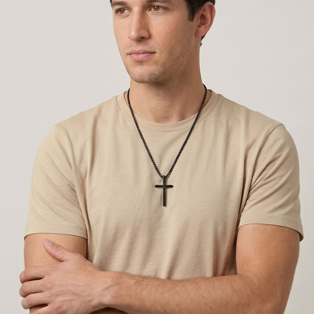 Man featuring Men's Black Cross Necklace with name engraving and simple styling
