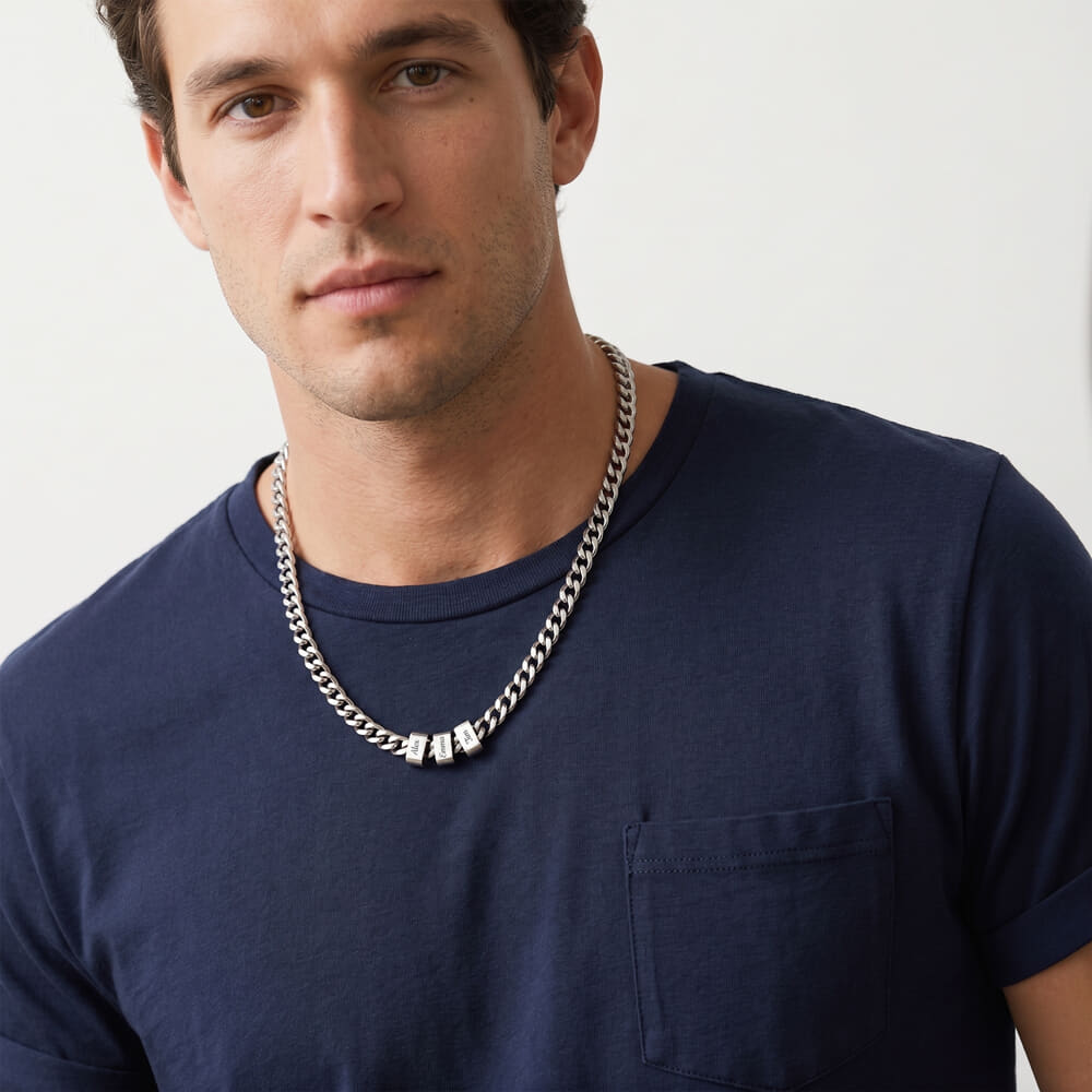 Model featuring a personalized engraved beaded Cuban chain necklace in a laid-back outfit