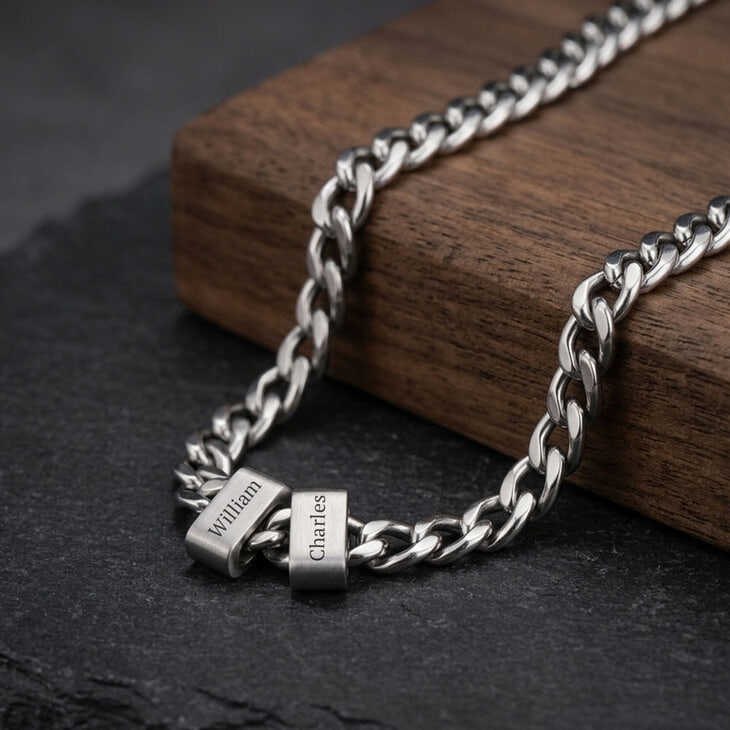 Model highlighting the engraved beaded Cuban chain necklace in a modern outfit