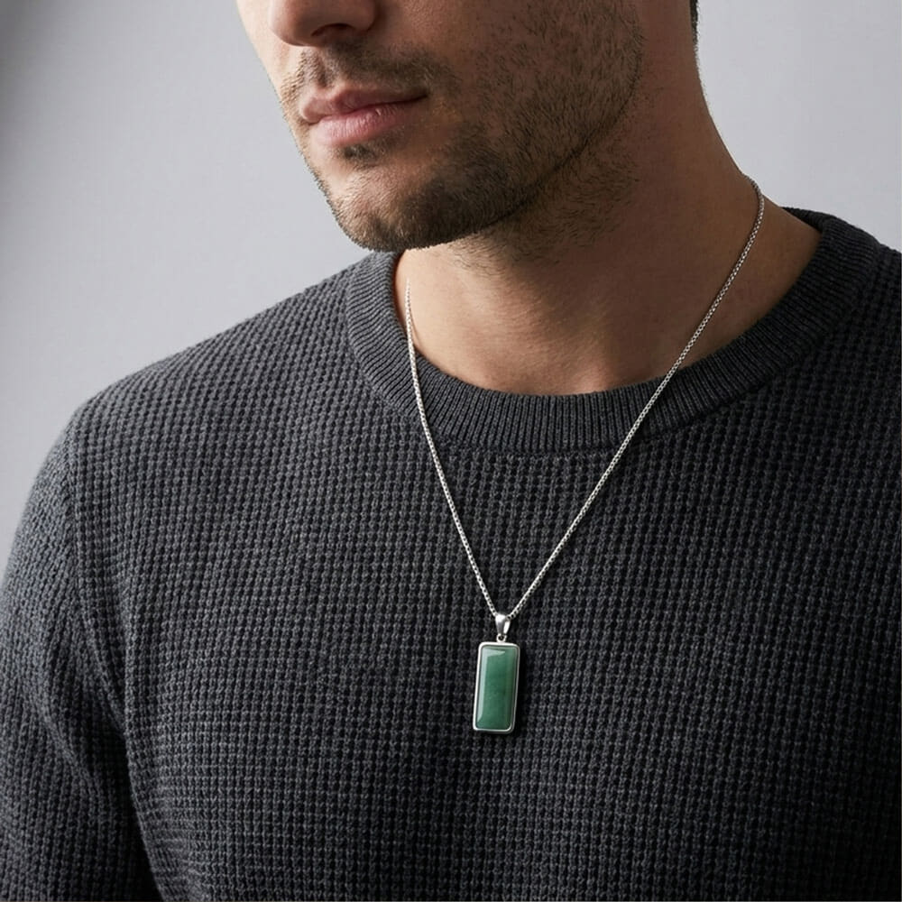 Man styled with the Emerald Edge Pendant necklace, highlighting the green aventurine stone