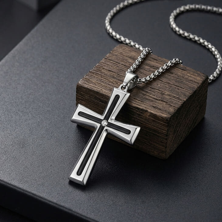Men's Black Inlay Cross Necklace in silver showcased on a dark wooden surface