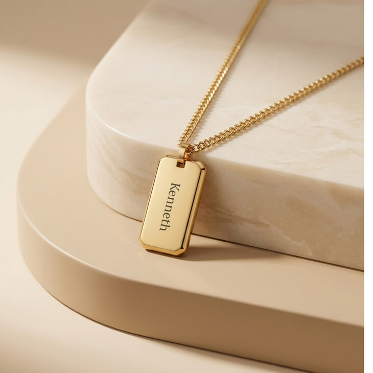 Silver engraved dog tag necklace for men on elegant marble display