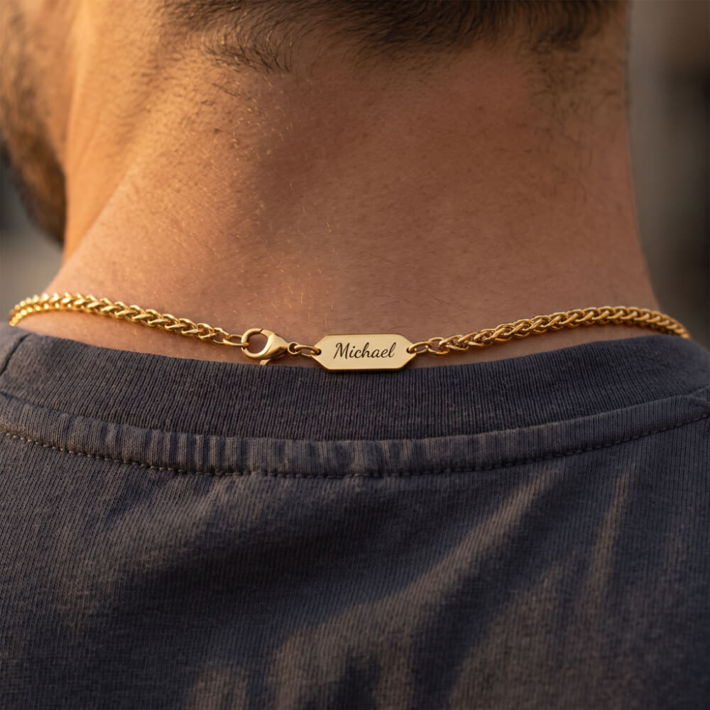 Close-up of the Men’s Personalized Engraved Nameplate Wheat Chain Necklace worn by a model
