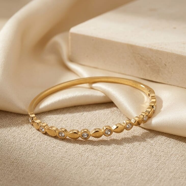 Stylish gold Alternating CZ Bangle Bracelet highlighting its marquise CZ accents