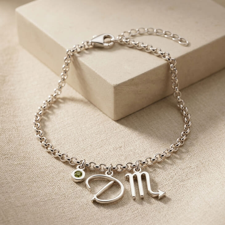 Stylish bracelet with zodiac script and sparkling birthstone visible