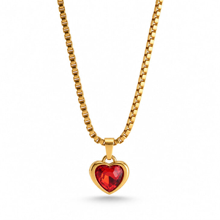 Gold heart necklace with a brilliant red gemstone centerpiece